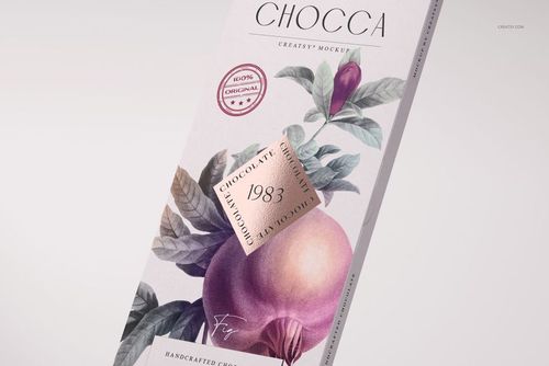 Front view of a chocolate bar packaging mockup with a fig illustration, purple and green leaves, and gold foil accents.
