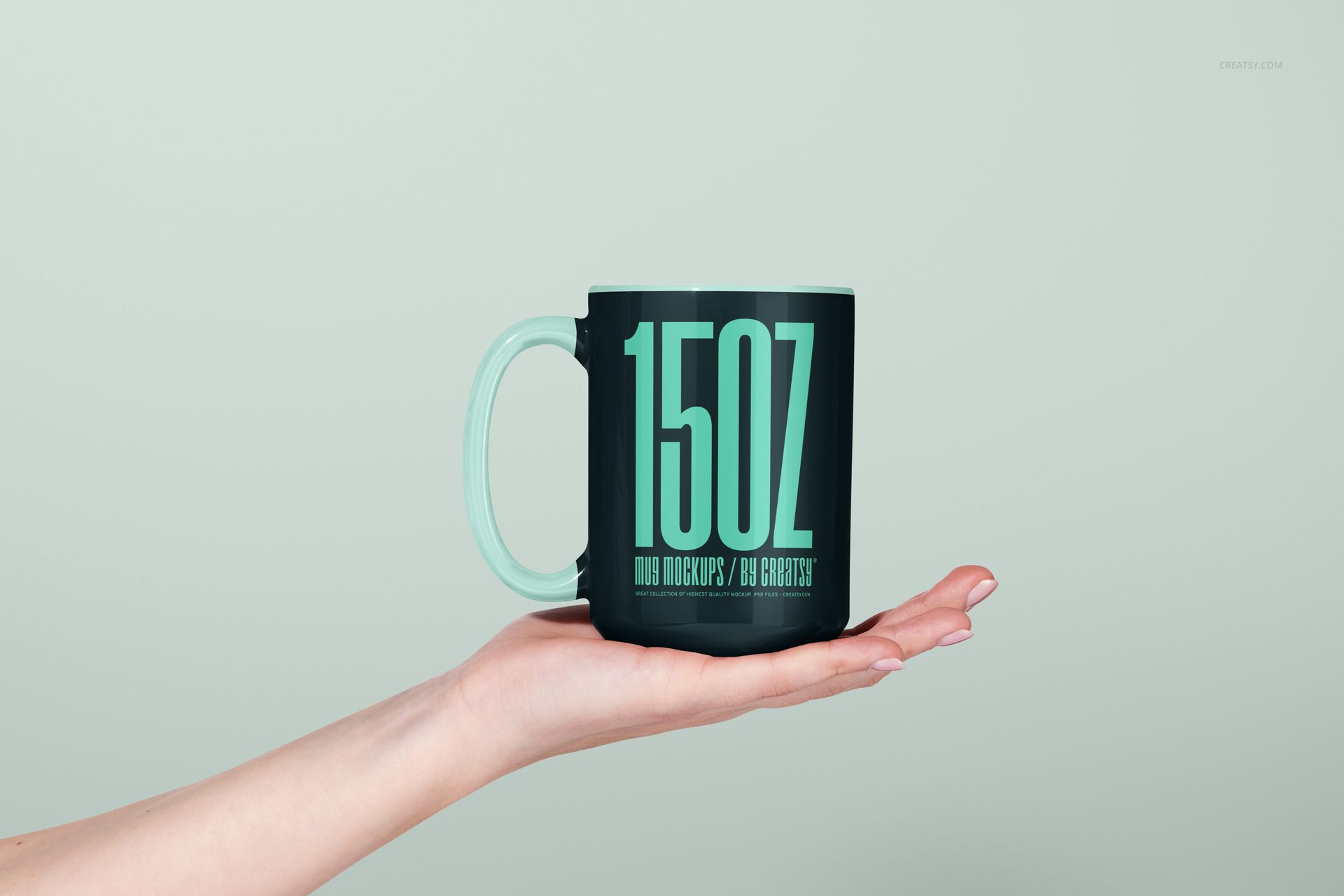 Front view of a 15oz ceramic mug mockup with a matte dark green finish, held by a hand against a light background.