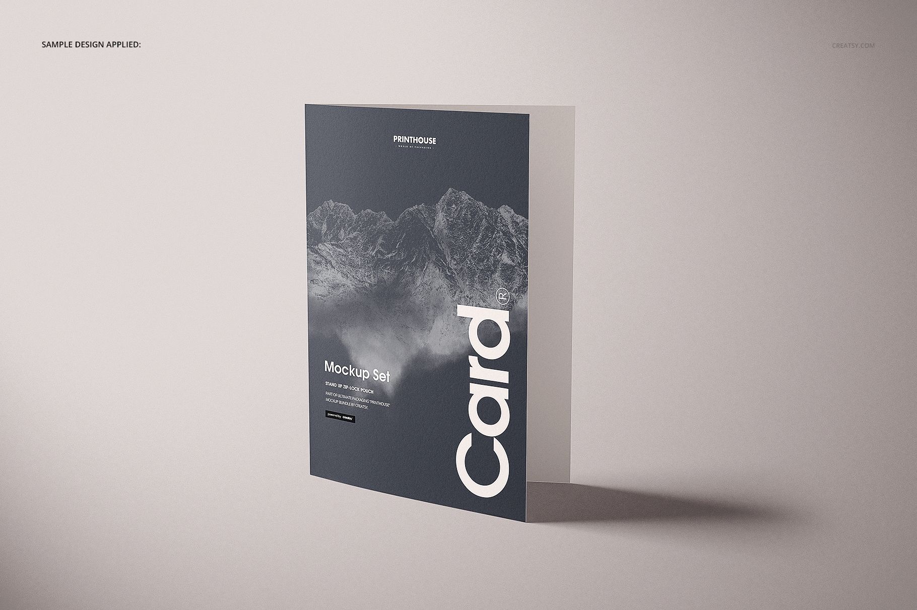 Front view of a folded A4 card mockup with a minimalist mountain pattern and text, set against a neutral background.