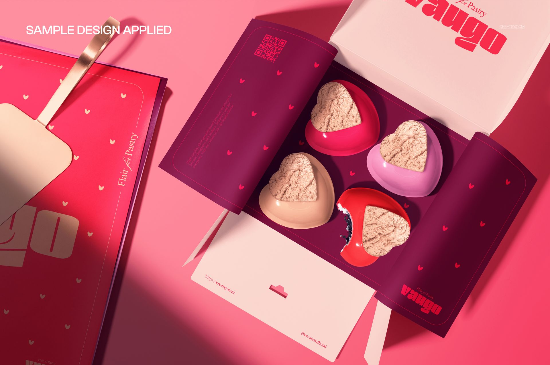 Heart shaped cakes in a pastry box mockup, viewed from above on a pink background with open packaging and four cakes.