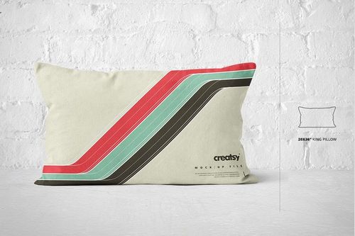 King size pillow mockup featuring colorful diagonal stripes, displayed on a bright white brick wall background.