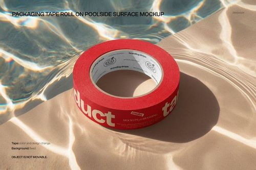 Red packaging tape roll mockup resting on a sunlit poolside surface, with water reflections and shadow effects.