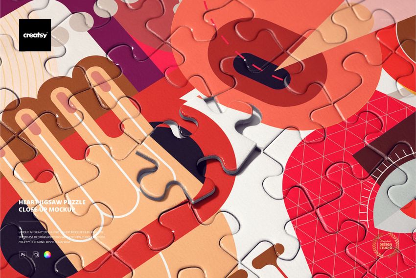 Heart jigsaw puzzle mockup showing interlocking pieces with vibrant geometric and abstract designs in warm tones.