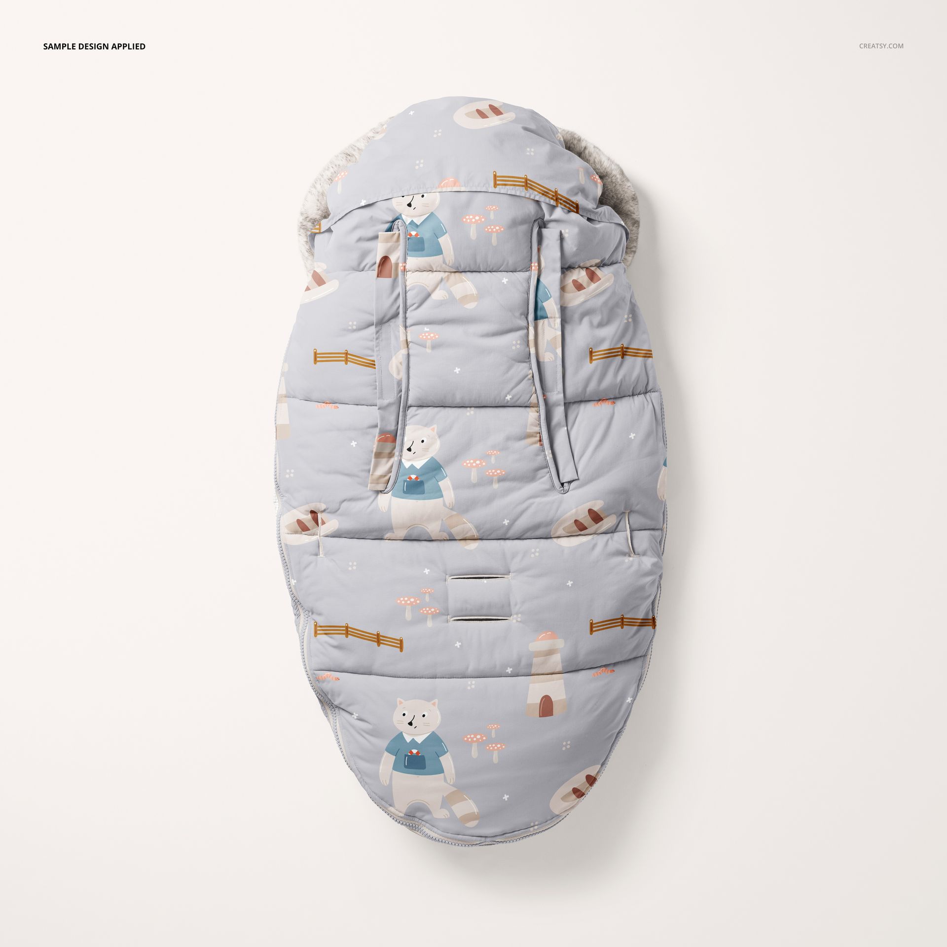 Baby footmuff mockup displayed from above, decorated with whimsical bears, fences, and soft pastel colors.