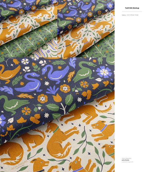 PSD mockup showing several folded fabrics with playful fox, bird, and floral motifs in earthy and bold tones.