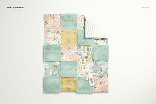 Baby patchwork quilt mockup with mixed pastel fleece and printed squares, displayed flat with a plush toy on white surface.