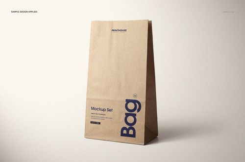 Kraft paper lunch bag mockup featuring bold blue and black text, shown from the front on a light surface.