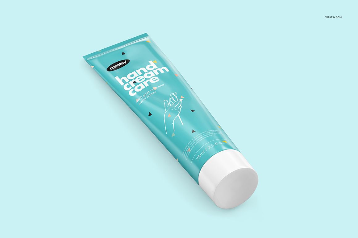 A personal care cream tube mockup with a teal body and white lid, displayed at an angle on a plain surface.