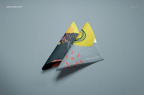 Paper napkins mockup featuring geometric and abstract designs in yellow, black, and red, shown from a top angle.