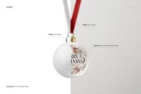Front view of a round bone china Christmas bauble mockup with floral design, gold holder, and red ribbon on a white background.