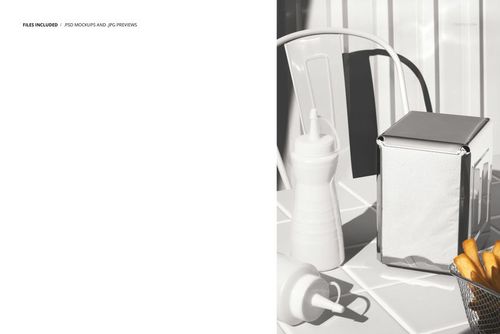 PSD mockup showing a fast food table setup with a napkin holder, plastic sauce bottles, and fries basket on a patterned surface.
