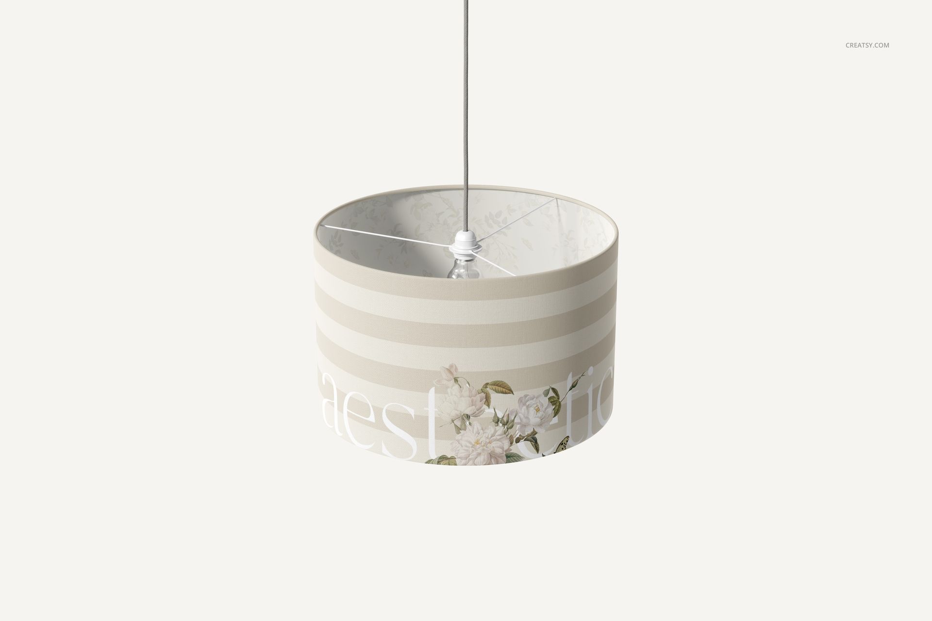 PSD mockup of a cylindrical lamp shade featuring soft beige stripes and delicate flower design, viewed from a slightly angled perspective.