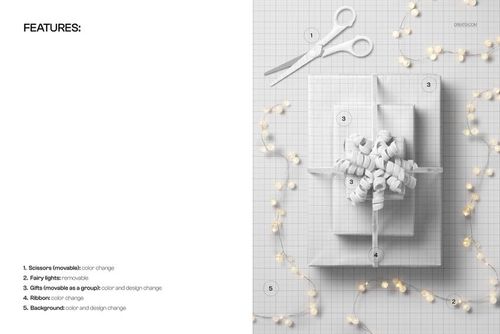 Top view of a Christmas gift mockup featuring a white ribbon, fairy lights, scissors, and a grid-patterned background.