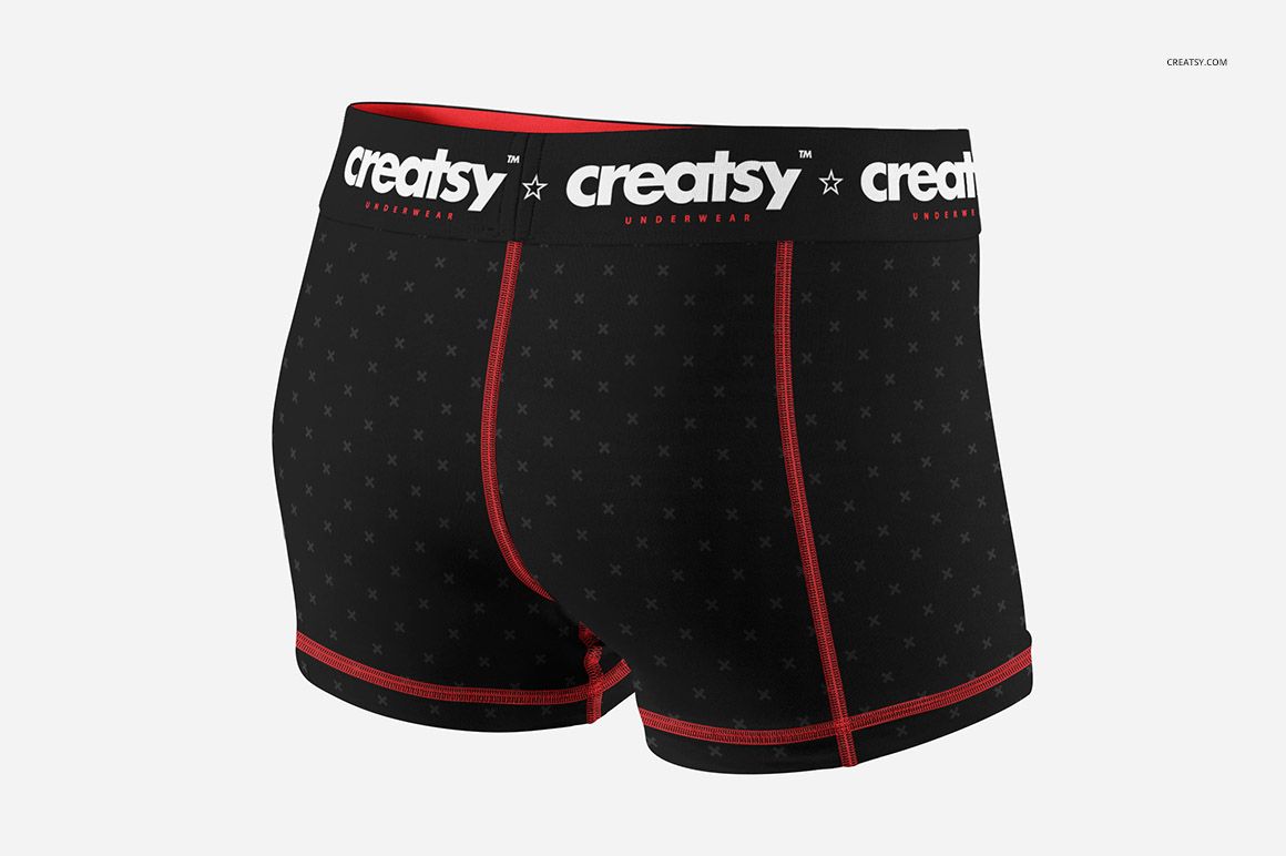 Adult compression shorts mockup featuring black fabric with subtle star design, red stitching, and white logo waistband.