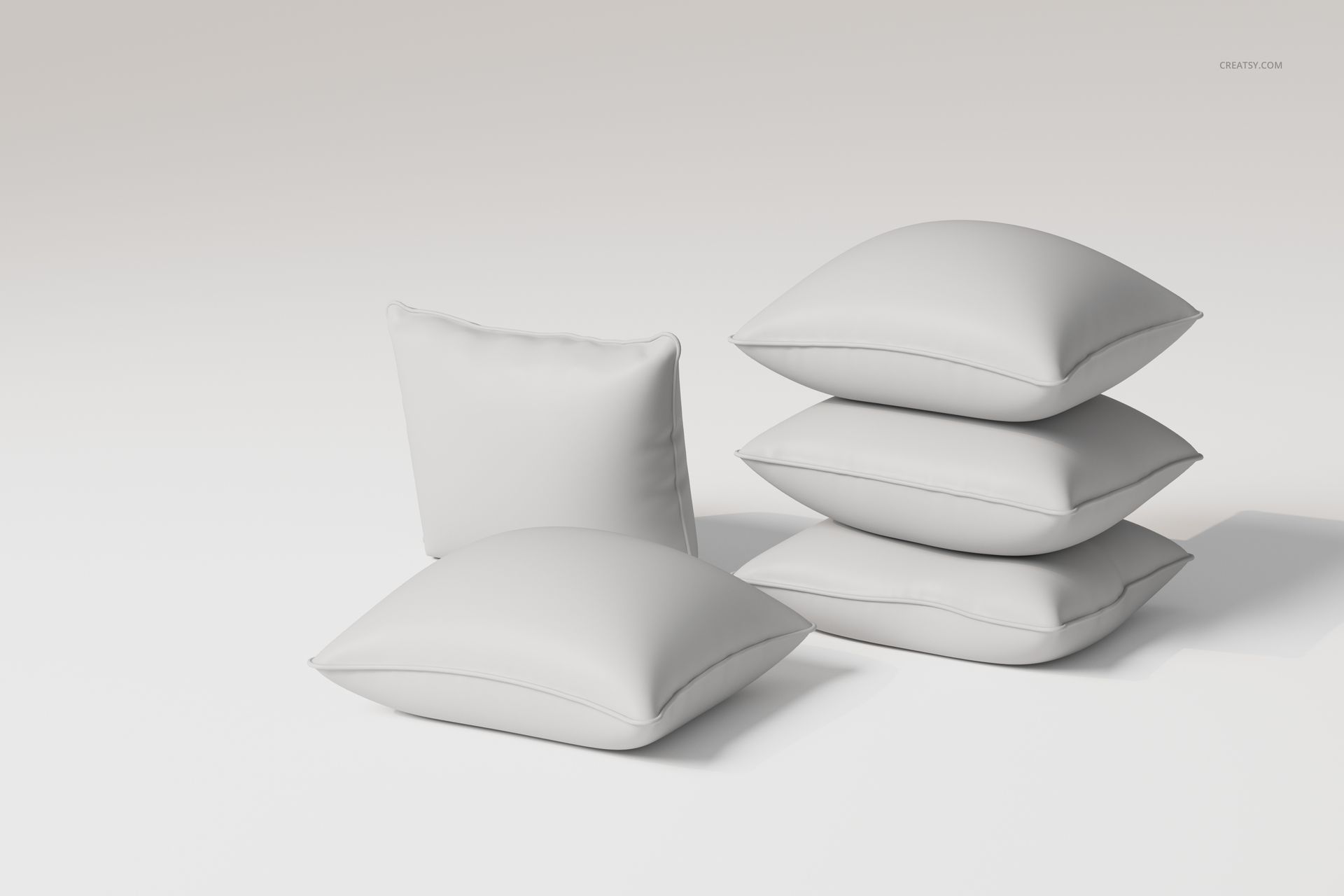 Front view of five white piped cushions arranged on a plain light background, showing soft fabric texture.