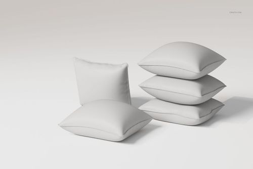 Front view of five white piped cushions arranged on a plain light background, showing soft fabric texture.