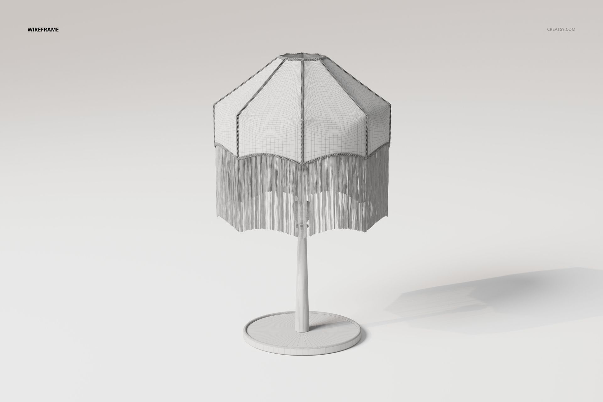 Wireframe view of a tassel shade lamp 3D model with a polygonal lampshade and fringe detail, shown from the front.