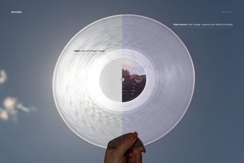 PSD mockup showing a hand holding a clear colored vinyl record outdoors, sunlight highlighting the grooves and label.
