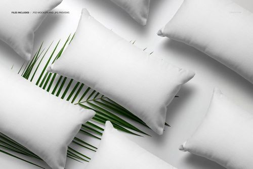 Rectangular pillow mockup set displayed on a white background with a palm leaf, showing blank fabric covers.