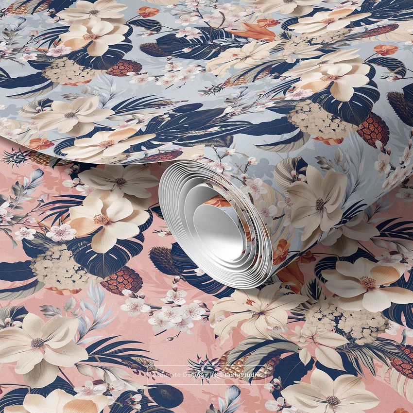 Paper wallpaper mockup showing a rolled sheet with a floral pattern in blue, cream, and pink tones on a flat surface.