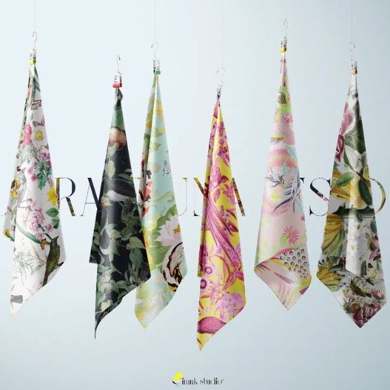 Hanging silks mockup featuring five patterned fabric pieces suspended on hooks, each with vibrant floral and fauna designs.