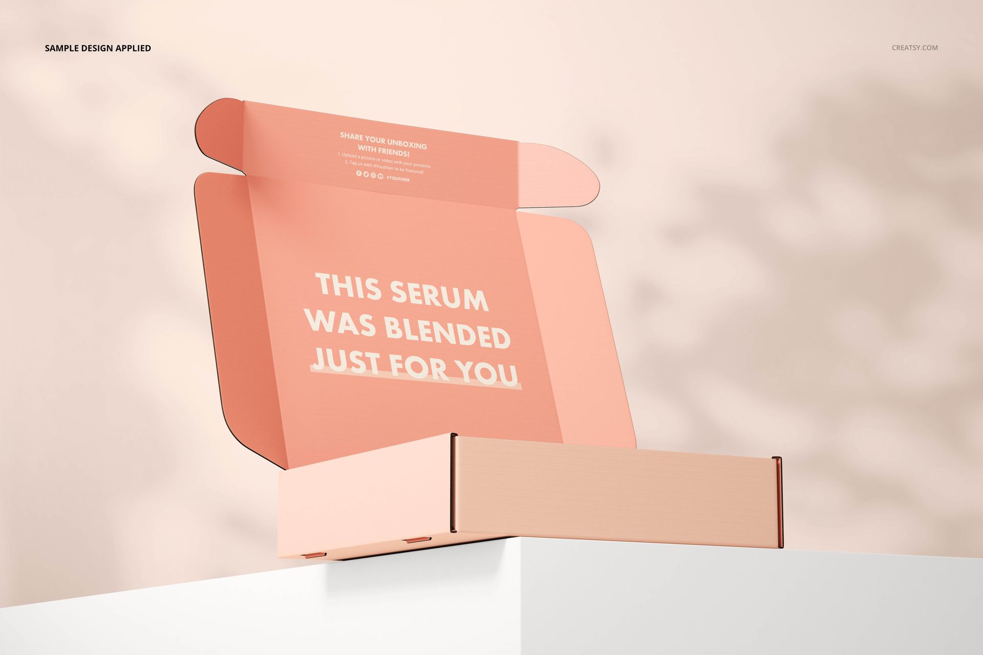 Open cosmetic mailing box mockup in pastel peach tones, front angle view with lid upright and visible interior text.