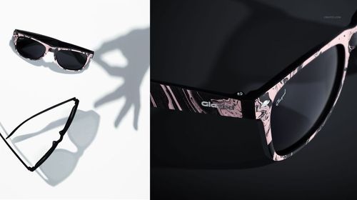 Sunglasses mockup set featuring two pairs with marbled pink and black frames, shown from top and close-up views.
