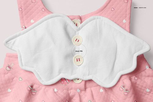 Front view of a pink baby dress mockup with a quilted texture, heart and pacifier patterns, and a white wing-shaped collar.