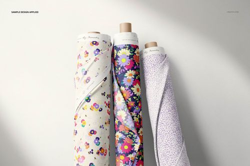 PSD mockup showing three patterned fabric rolls with floral prints, arranged vertically on a neutral background.