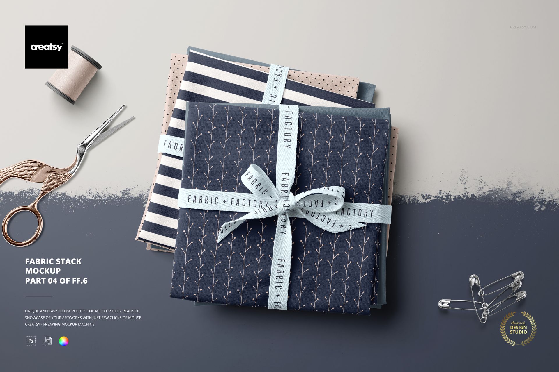 Top view of a fabric stack mockup featuring assorted folded textiles with ribbon, scissors, and sewing props.