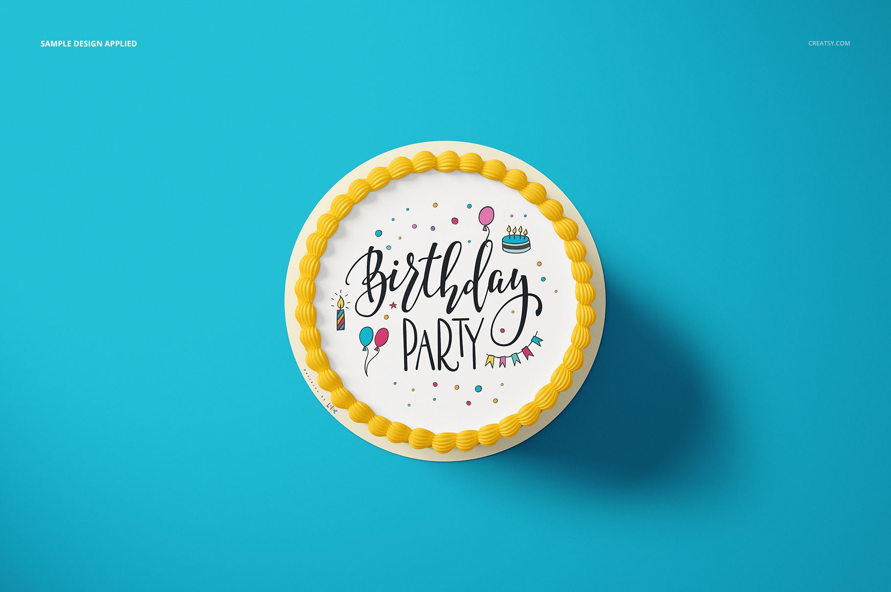 PSD mockup of a round cake with festive birthday decorations and yellow icing edge, displayed from above on blue.