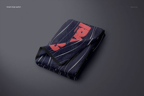 Navy blue towel mockup featuring red lettering and white diagonal stripes, shown folded on a neutral background.