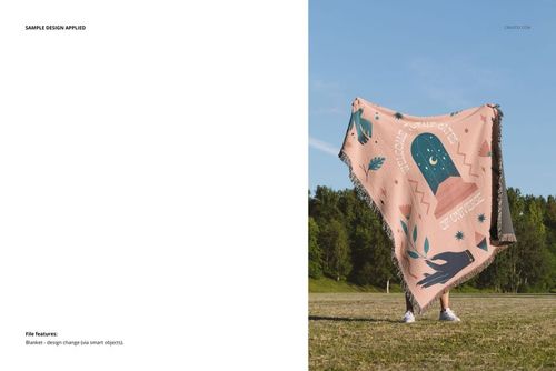Fringed woven throw blanket mockup featuring a pink background with blue and black shapes, displayed in a grassy park.