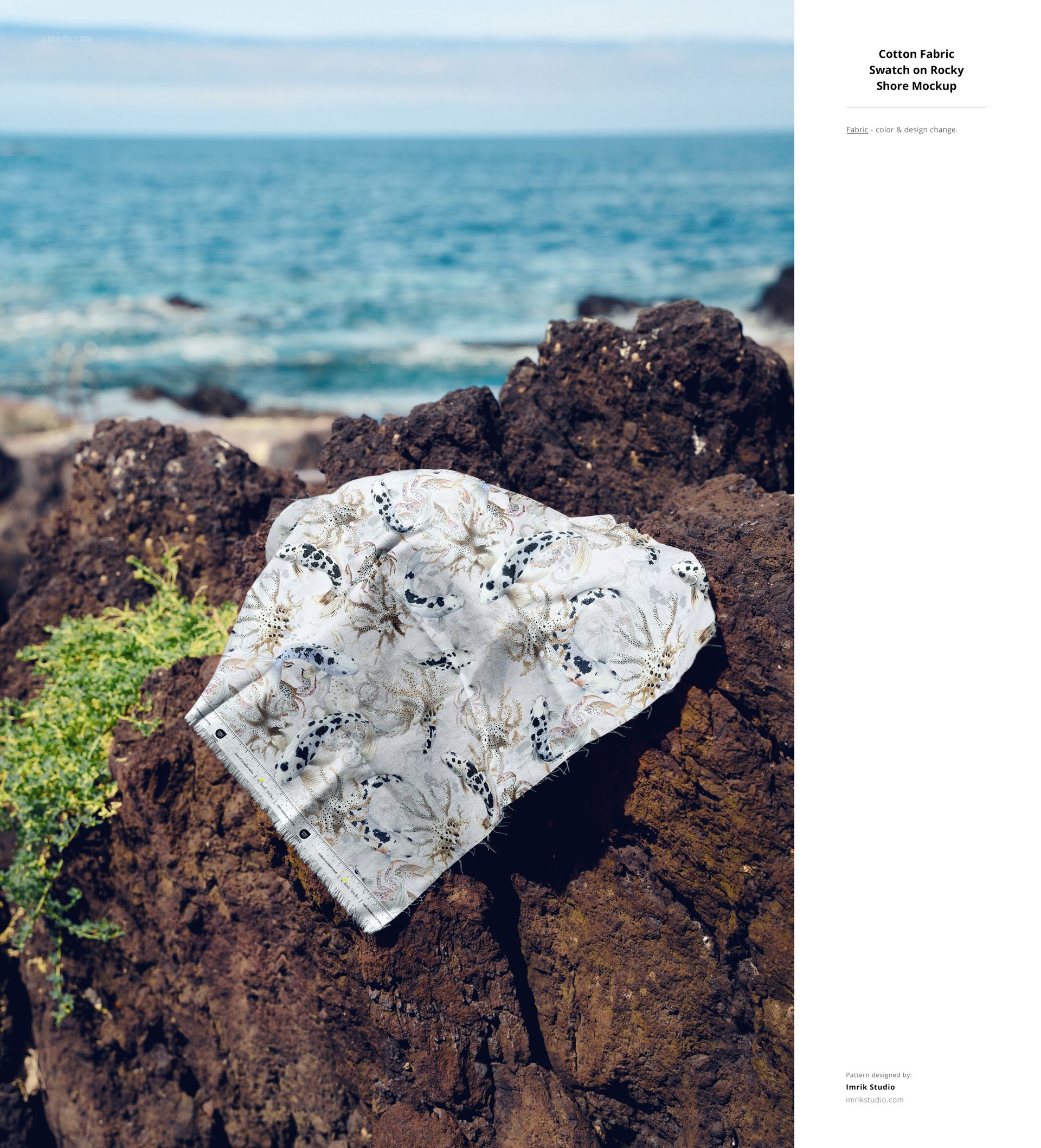 PSD mockup of decorative fabric featuring birds and flowers, laid on rugged rocks by the coastline under a blue sky.
