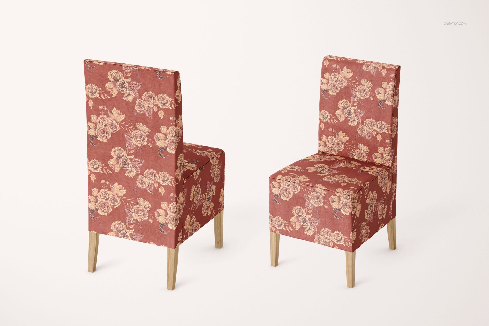 PSD mockup of two dining chairs with red and beige flower pattern covers, positioned side by side on a white background.