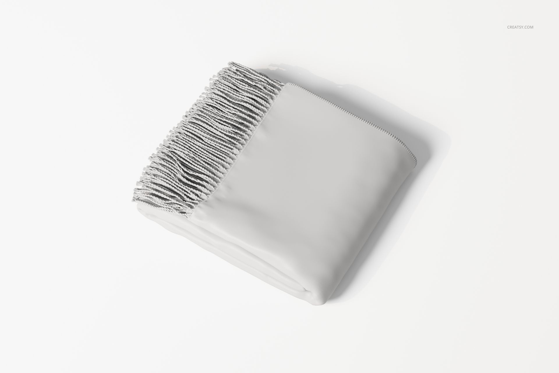 Folded throw blanket in light gray color with fringed edge, shown from a top angle on a white surface.