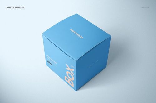 Square matte gift box in blue with white text, shown from a high angle on a light background, packaging mockup.