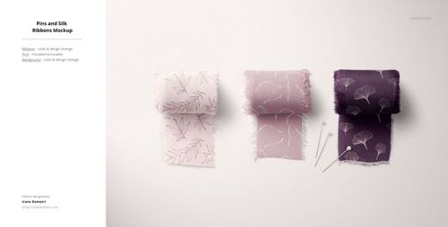 Textile mockup showing three pieces of patterned fabric and sewing pins arranged on a neutral background.