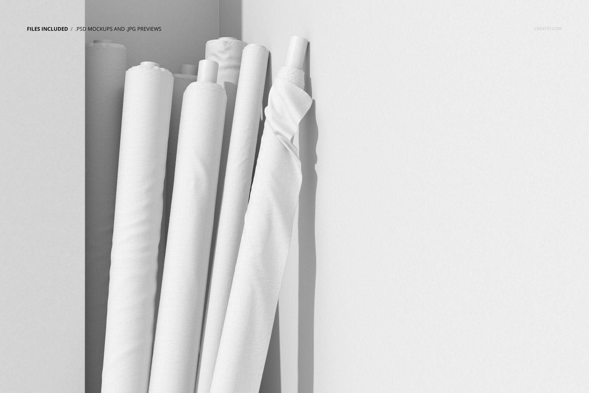 White fabric rolls mockup displayed vertically, highlighting smooth textures and simple shadows on a neutral background.