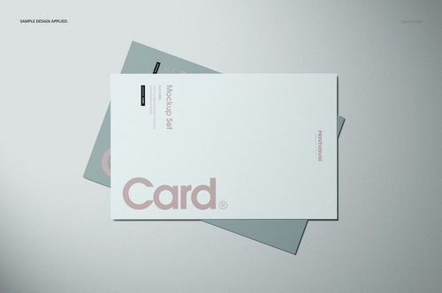 Flat cards mockup with overlapping white and green cards on a light gray background, viewed from above.