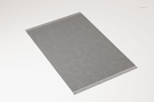 Large rectangular fringed rug in solid gray color, viewed from a slightly angled top perspective on a white surface.