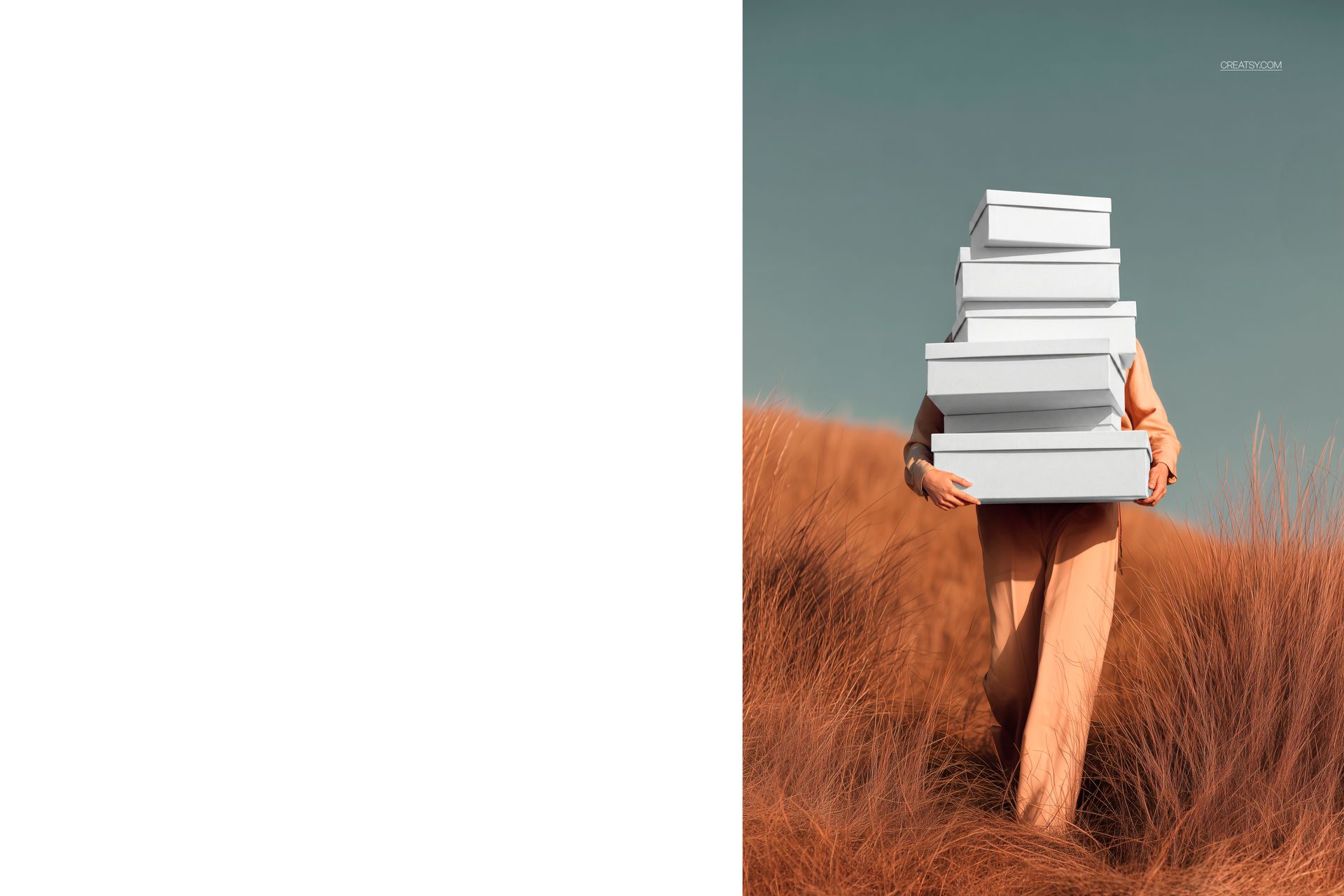 Front view of a woman in neutral clothing holding a stack of white shoe boxes in tall pampas grass, PSD mockup scene.