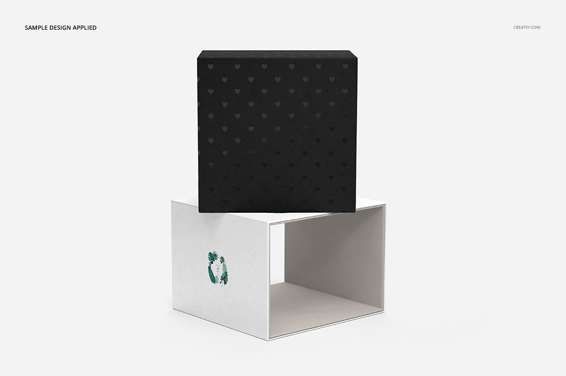 Front view of an acrylic USB drive slide box mockup set with a black lid featuring a subtle heart pattern and a white base.