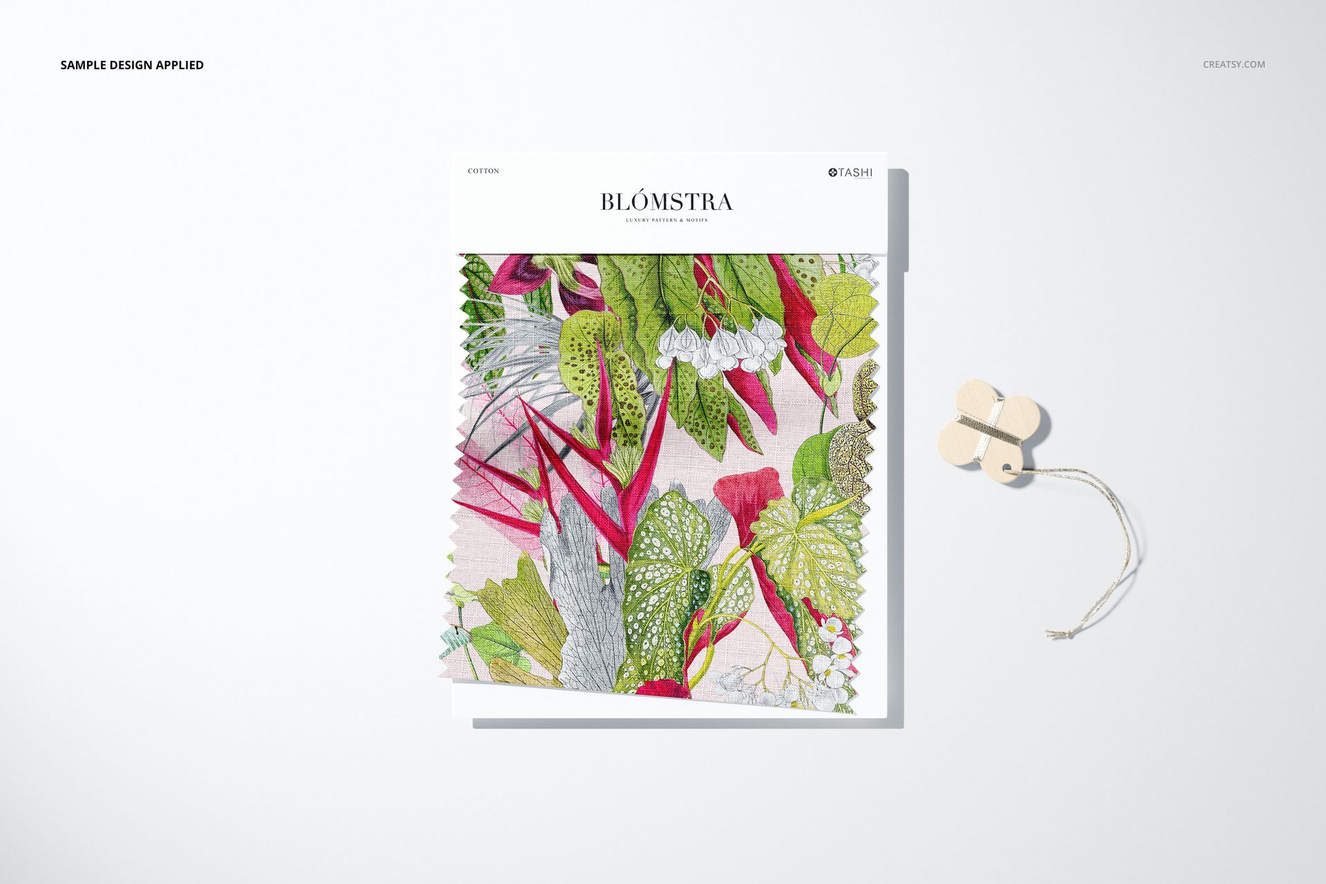 Fabric swatch mockup featuring a square textile sample with colorful botanical pattern, front view on a light background.