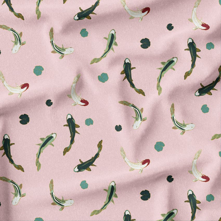Creased fabric mockup featuring a repeating koi fish pattern on a soft pink background with scattered teal spots.