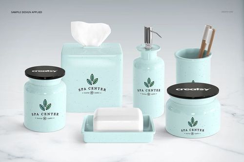 Collection of pastel blue bathroom items with pump bottle, soap dish, and jars displayed on a white surface, PSD mockup.