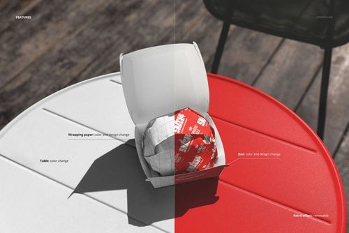 Outdoor table with a burger wrapped in patterned paper inside an open box, shown in a split-color mockup scene.