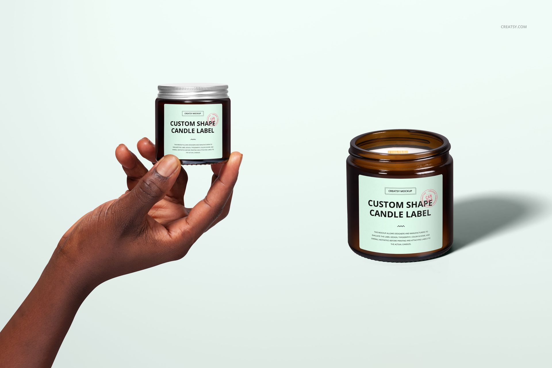 Amber jar candle mockup set featuring two candles with custom labels, shown from the front on a pale background.