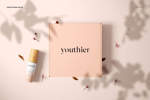 Cosmetic packaging mockup featuring a pastel pink box and a wooden-capped bottle, surrounded by leaves and flower petals.
