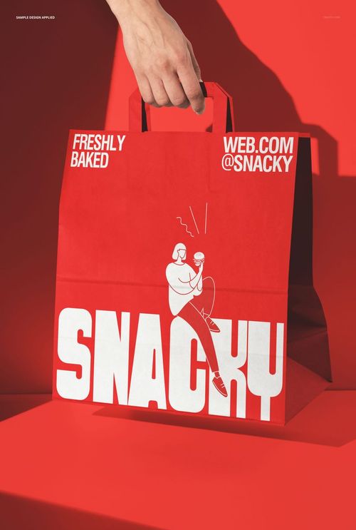Front view of a red paper packaging bag mockup with large white lettering and graphic, set against a solid red backdrop.